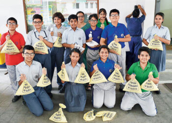 Students donating rice to be distributed in schools where children from marginalised families study