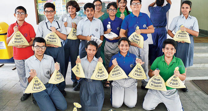 Students donating rice to be distributed in schools where children from marginalised families study