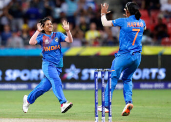 Poonam Yadav (left) celebrates with teammate Harmanpreet Kaur after taking the wicket of Australia's Jess Jonassen during the first game of the Women's T20 Cricket World Cup in Sydney on Friday