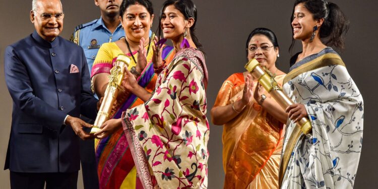 Mountaineers Tashi Malik and Nungshi Malik receive Nari Shakti Puraskar 2019 on International Womens Day from President Ram Nath Kovind as Union Minister Smriti Irani looks on, at Rashtrapati Bhavan Cultural Center in New Delhi, Sunday, March 8, 2020