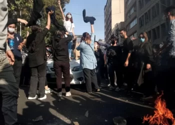 Iranian women on October 1, 2022, protest the death of Mahsa (Jina) Amini after she was detained by the morality police, in Tehran.