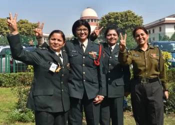 Lt. Col. Seema Singh (2L) and other women army personnel show victory signs after the apex court’s decision to apply permanent commission to all women officers in the Indian Army, at Supreme Court in New Delhi.