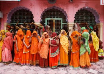 Women wait to take part in Huranga, a game played between men and women, a day after Holi at Dauji temple near the northern city of Mathura, India, on March 9.
