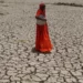 A woman crossing dry Sabarmati riverbed in India. India’s rural women are bearing the brunt of climate related shocks like severe drought and extreme weather events,